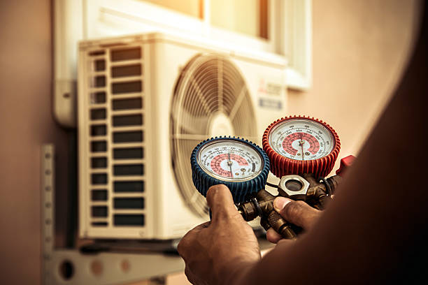 Professional Air Conditioning Service technician working in Old Westbury, NY